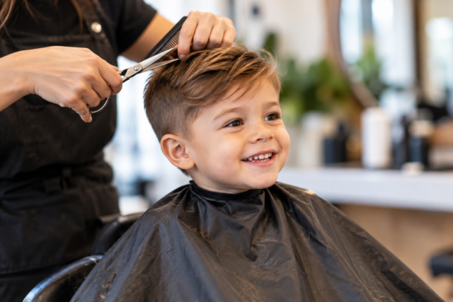 Young child getting a kids haircut at a hair salon in North York